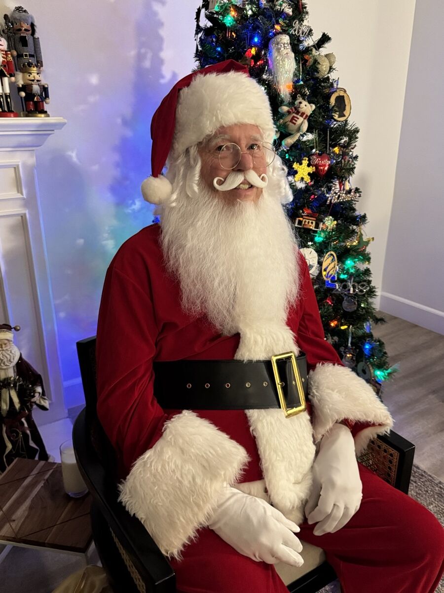 Santa Claus in his velvet suit and gold-buckled black belt